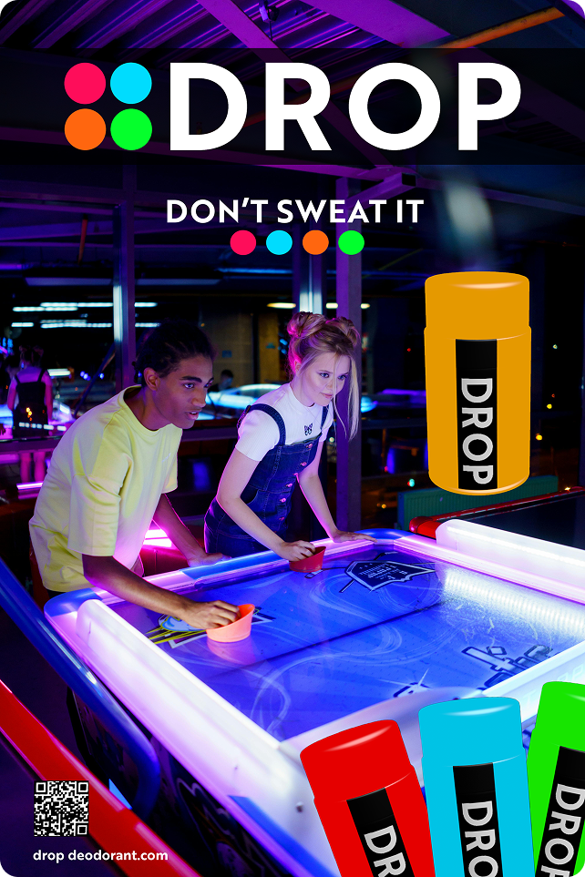 friends playing air hockey with DROP deodorant